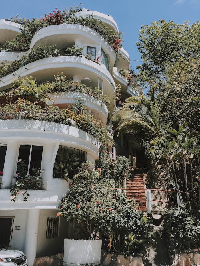 White Concrete House Near Trees